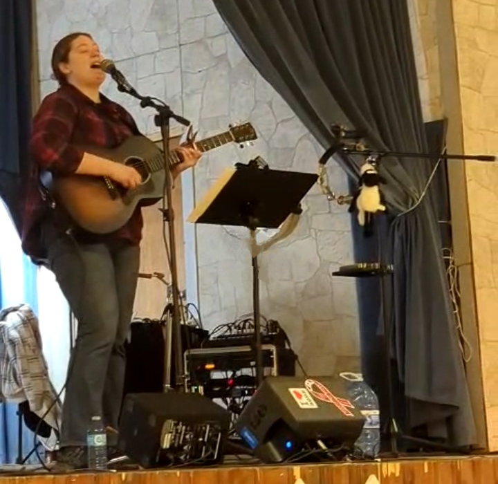 Emily Faye performing on stage